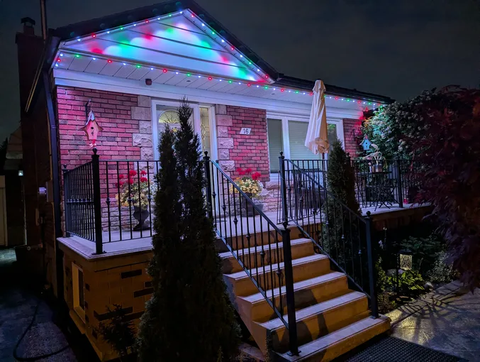 GTA home with colourful permanent Christmas lights installed along the roofline by Toronto Glow.