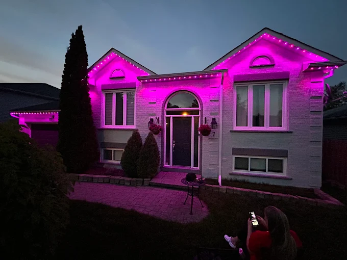 GTA home glowing in vivid pink with Toronto Glow's permanent Christmas lights — controlled from a smartphone in seconds.