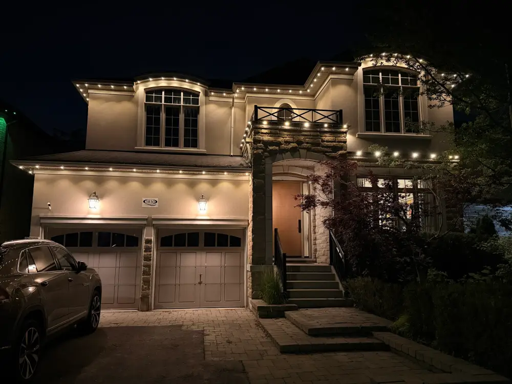 GTA home with outdoor track lighting on stucco facade installed by Toronto Glow