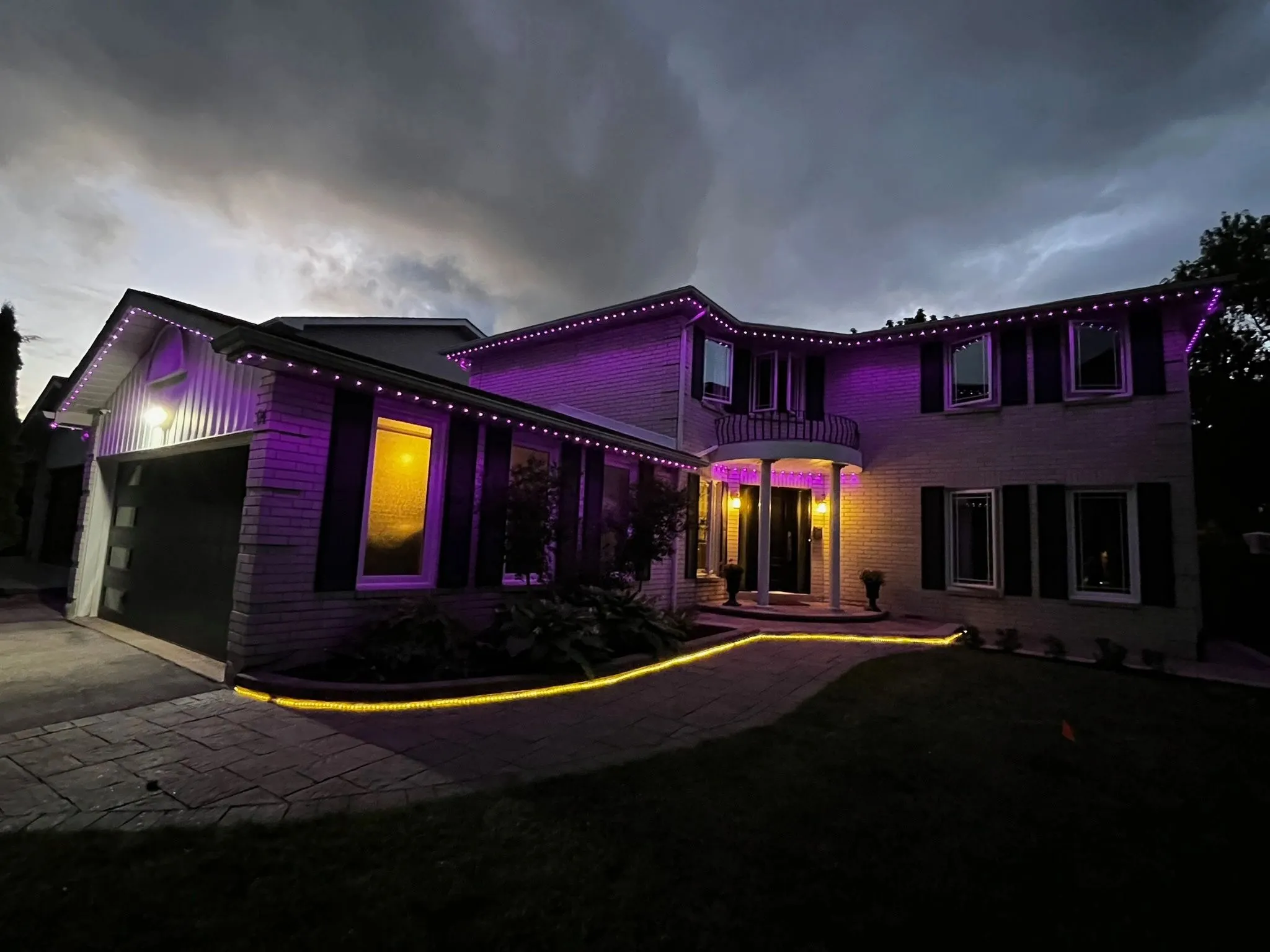 Etobicoke home with permanent outdoor LED lighting in purple installed by Toronto Glow
