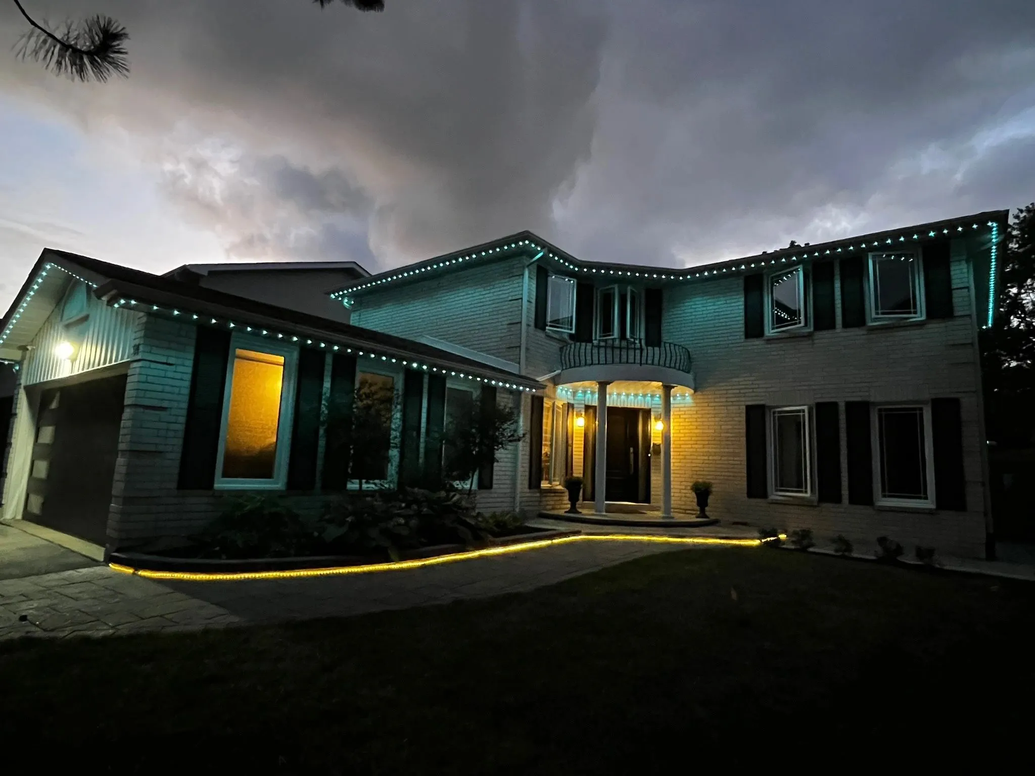 Etobicoke home with permanent outdoor LED lighting in pink installed by Toronto Glow