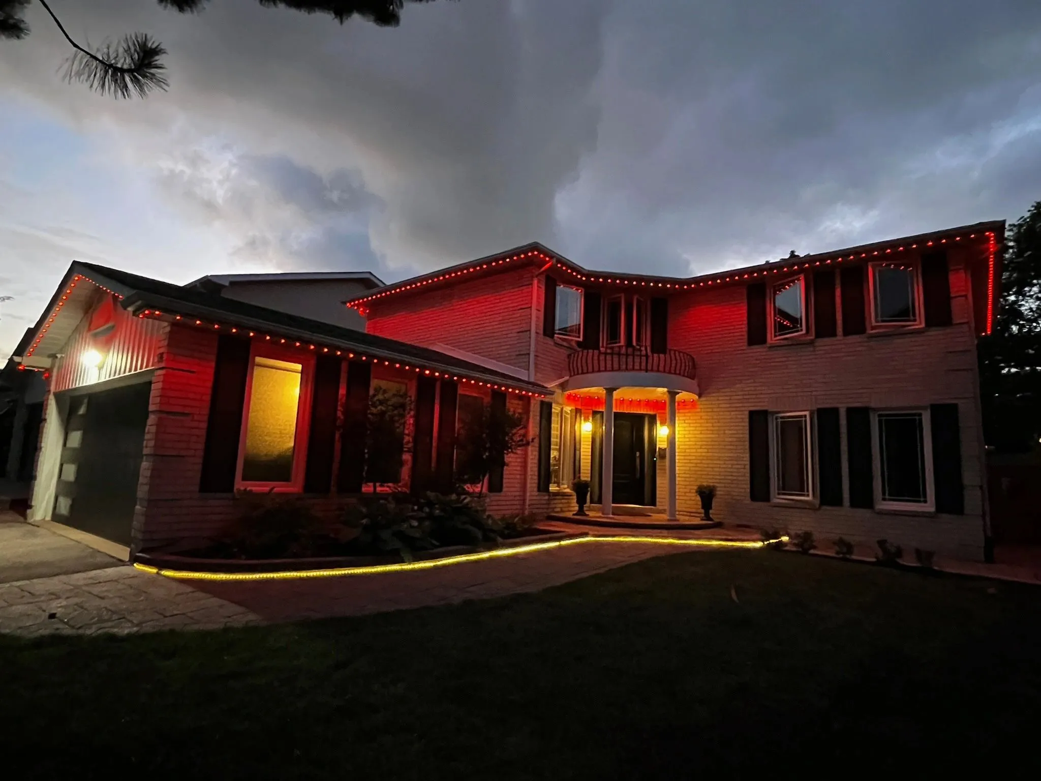 Etobicoke home with permanent outdoor LEDs in warm white installed by Toronto Glow
