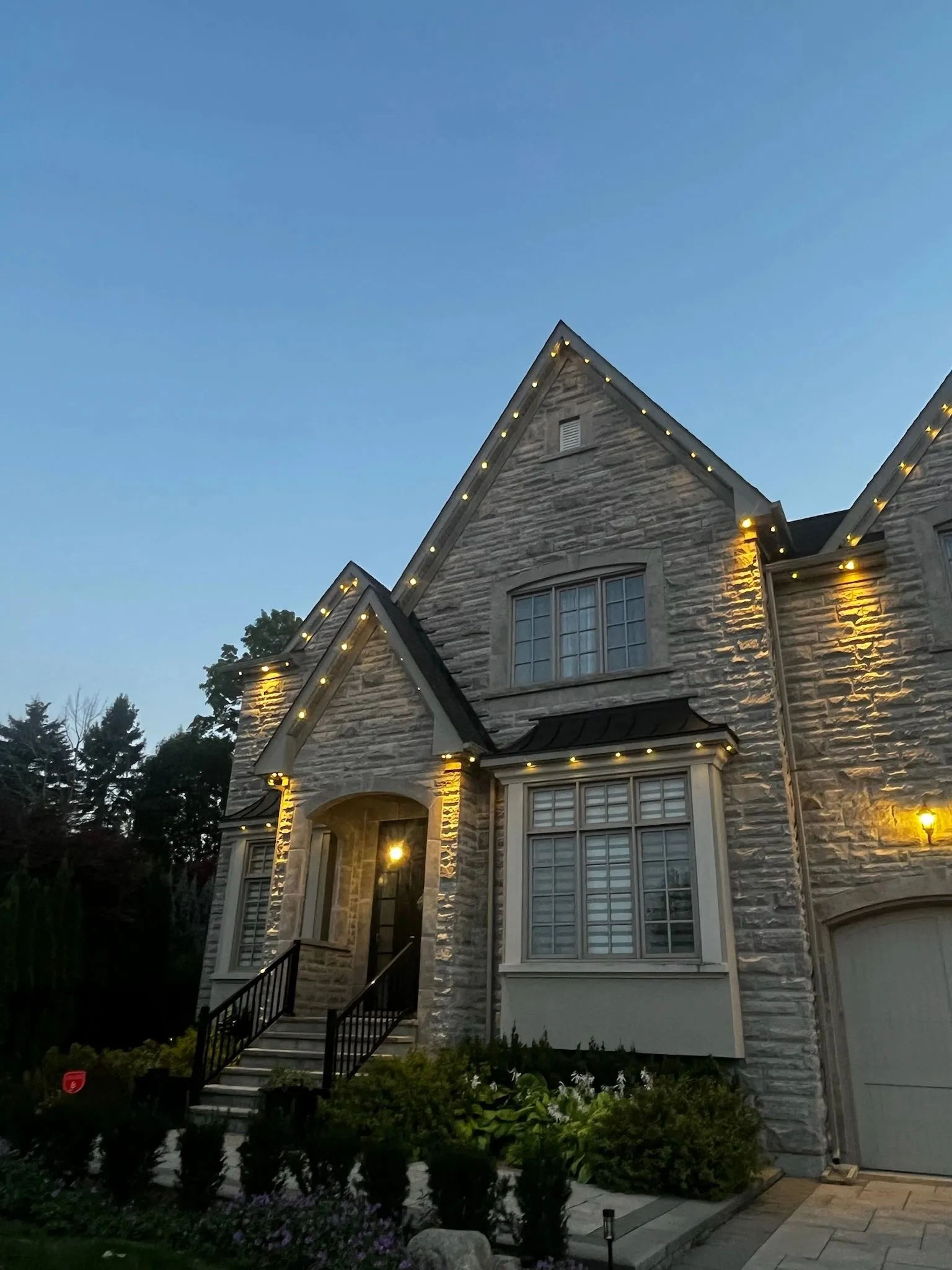 GTA home with permanent soffit lighting in warm white installed by Toronto Glow