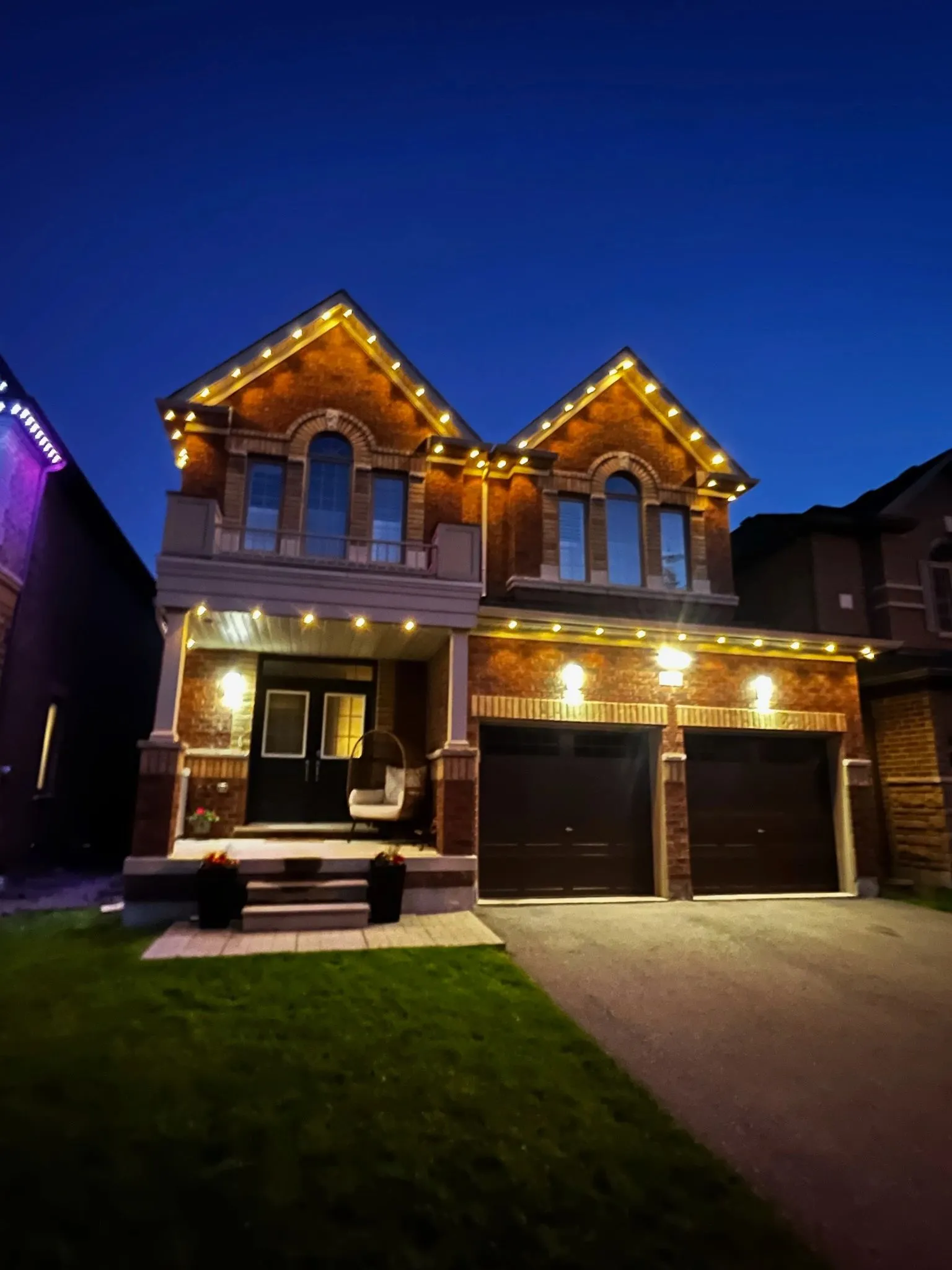 GTA home with permanent soffit lighting in warm amber installed by Toronto Glow
