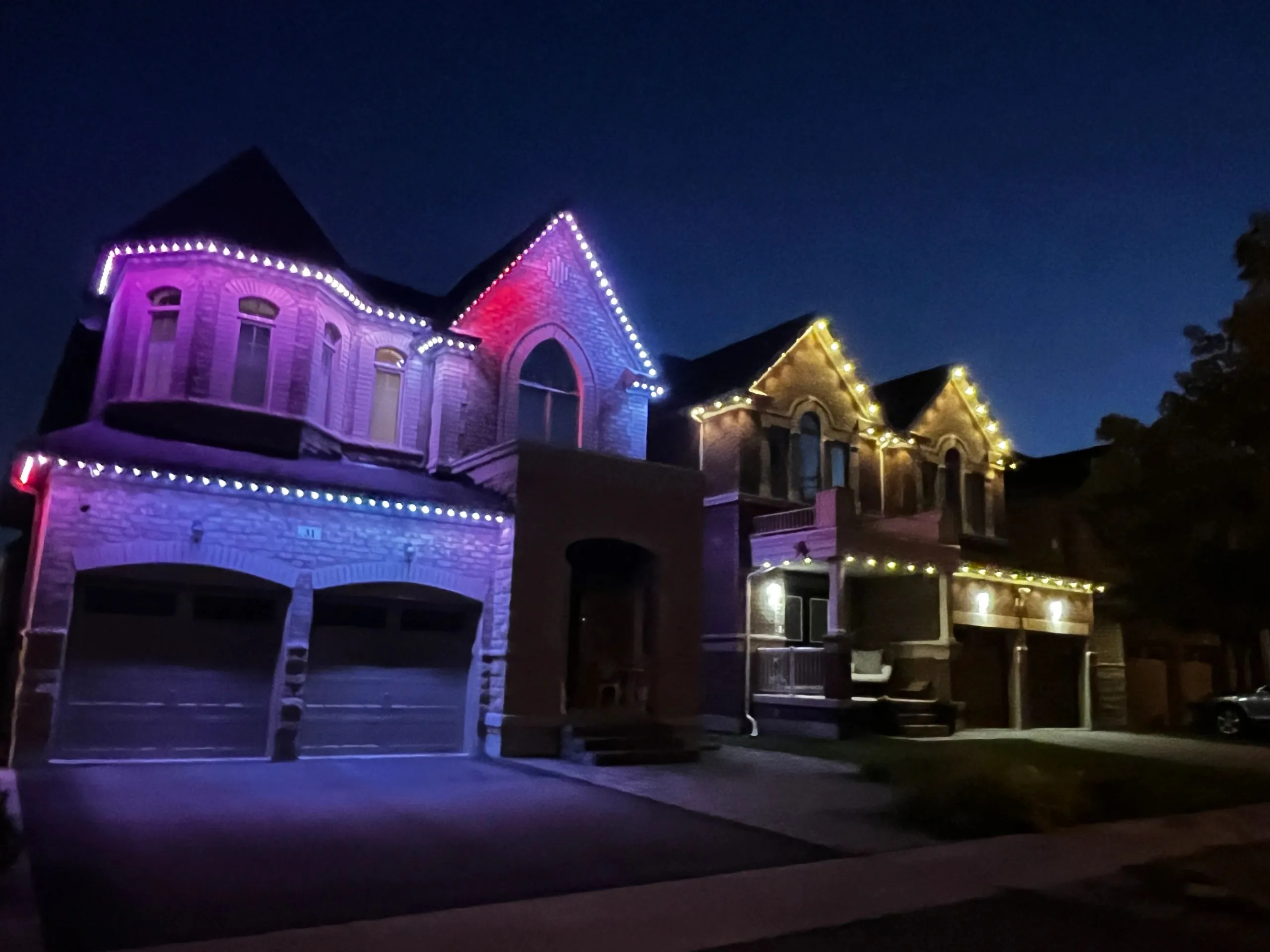 GTA luxury home with permanent soffit lighting in warm white installed by Toronto Glow