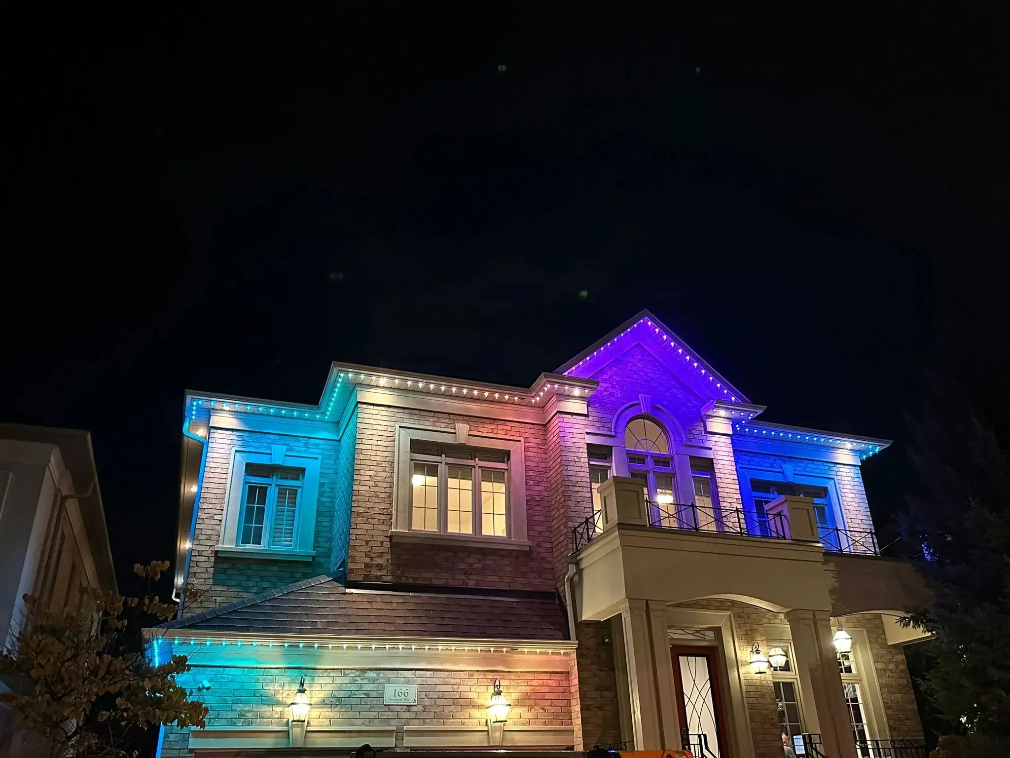 Toronto home with permanent holiday lights in multicolour installed by Toronto Glow