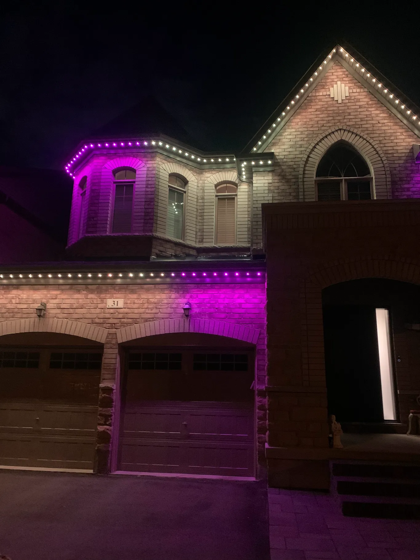 GTA home lit in bright magenta and white permanent LED lights for Diwali