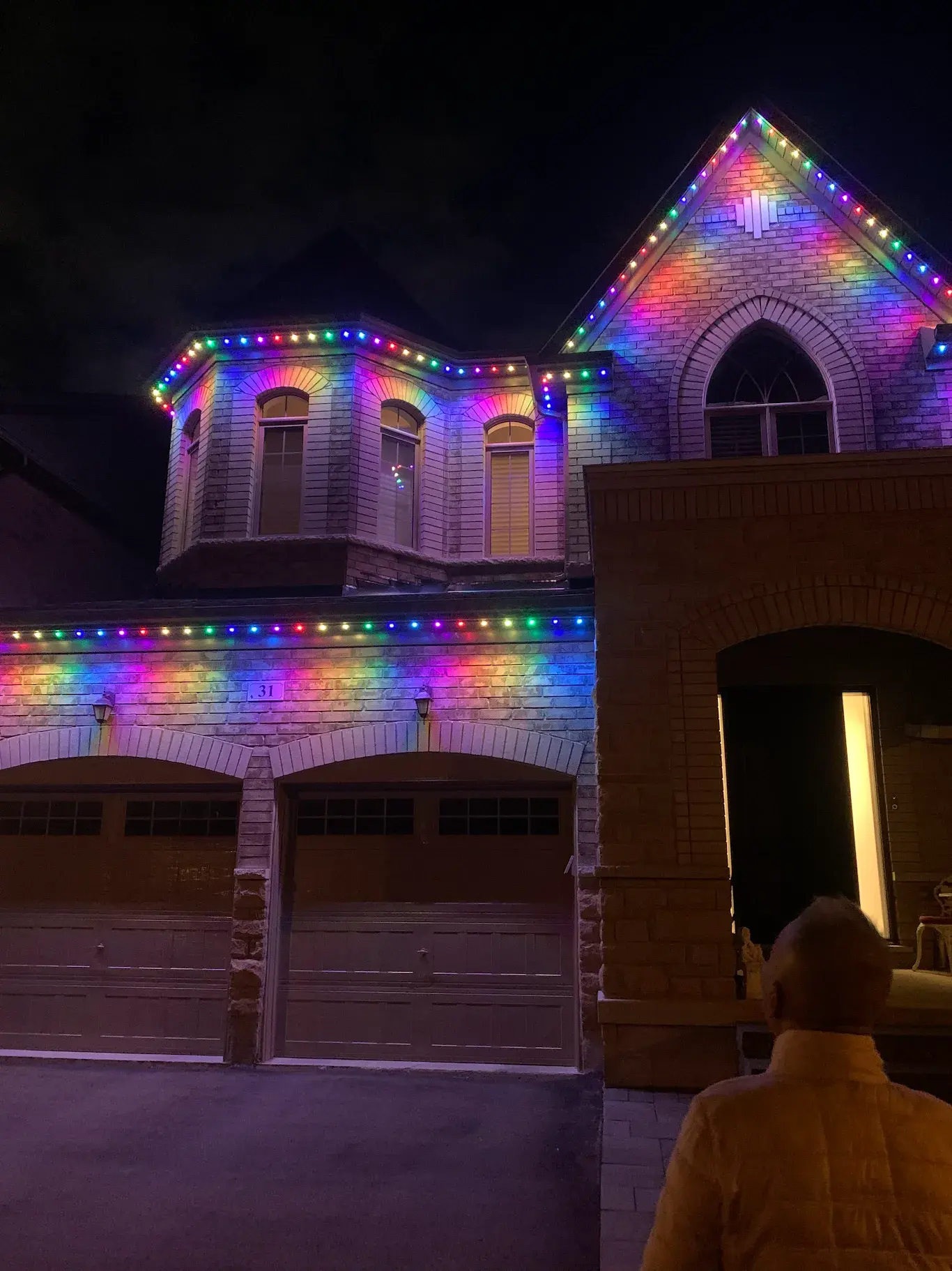 GTA home with rainbow coloured permanent LED lights for Diwali at night