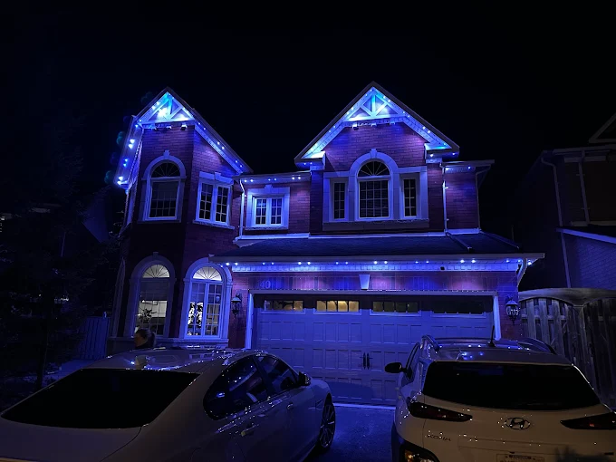 GTA home with blue permanent LED roofline lighting by Toronto Glow