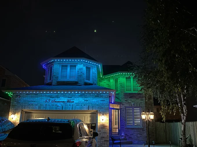 GTA home with smart exterior lighting in blue and green installed by Toronto Glow