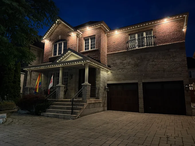 GTA home with warm white permanent LED roofline lighting by Toronto Glow