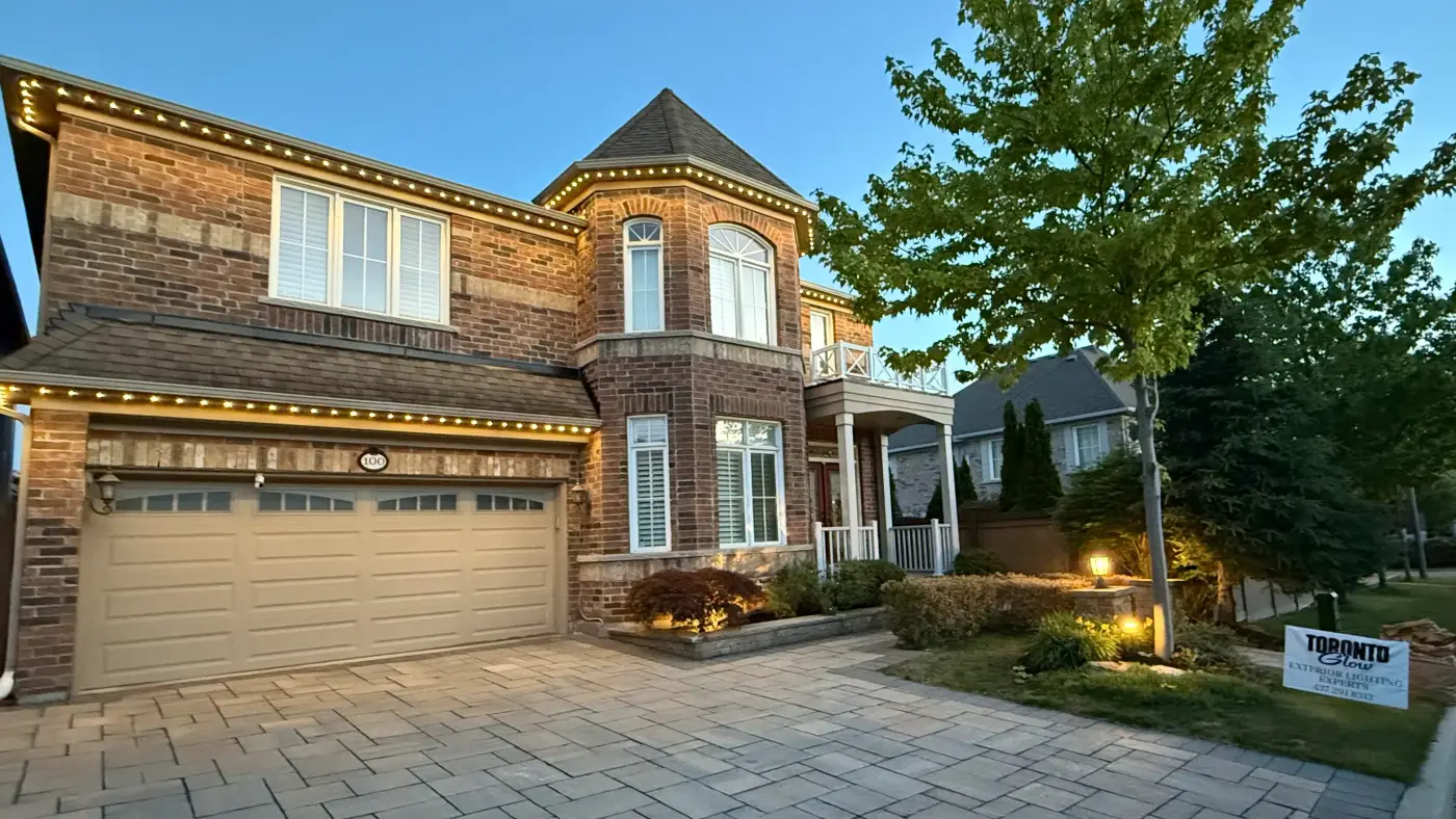 GTA brick home with warm white permanent LED roofline lighting by Toronto Glow