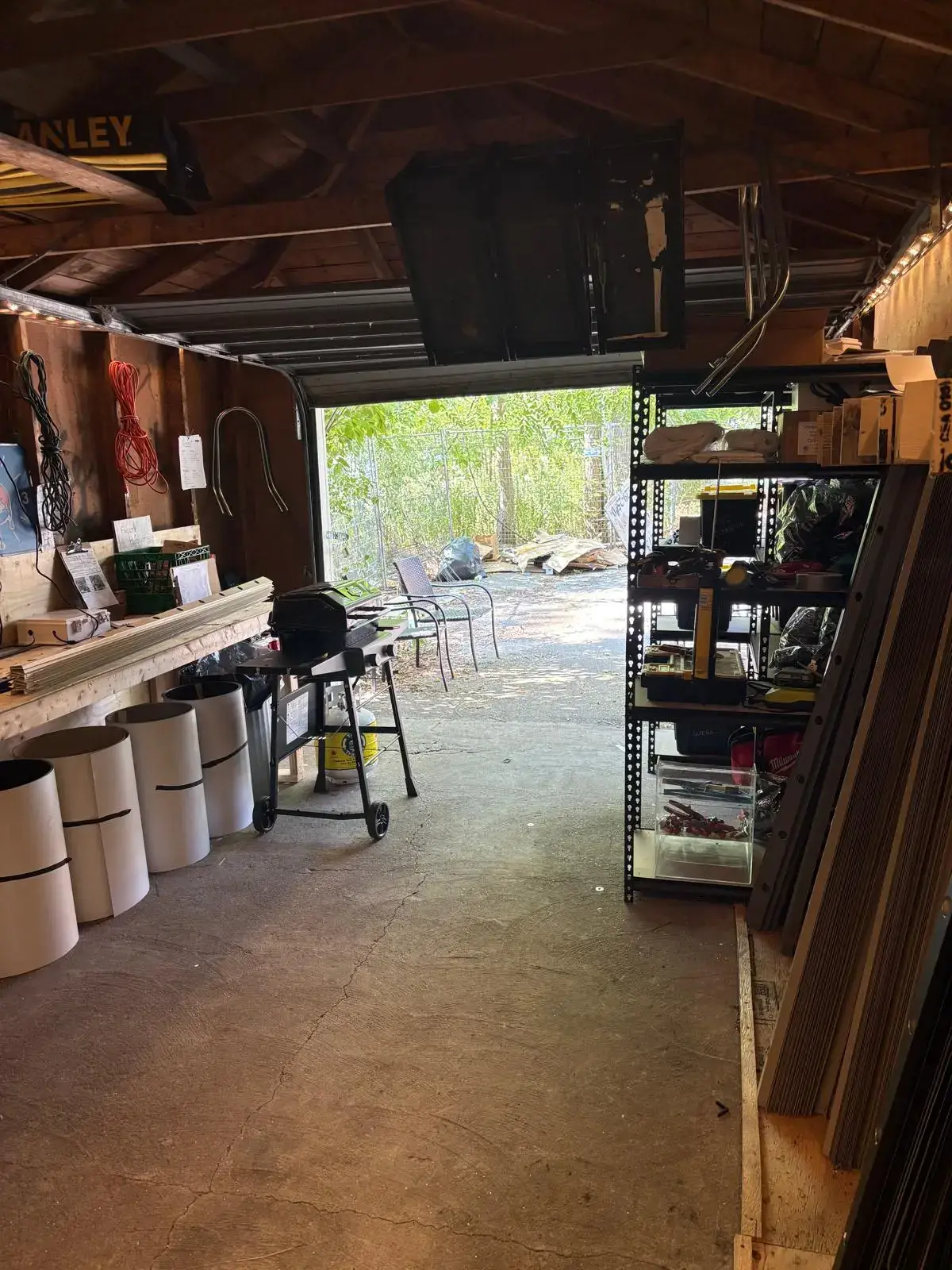 Interior of the Toronto Glow workshop showing organized shelving and supplies