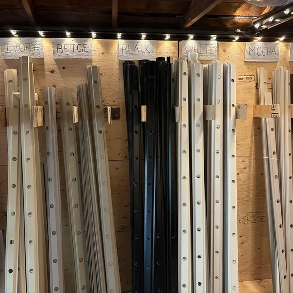 Colour-matched aluminum tracks organized by colour at Toronto Glow's North York shop