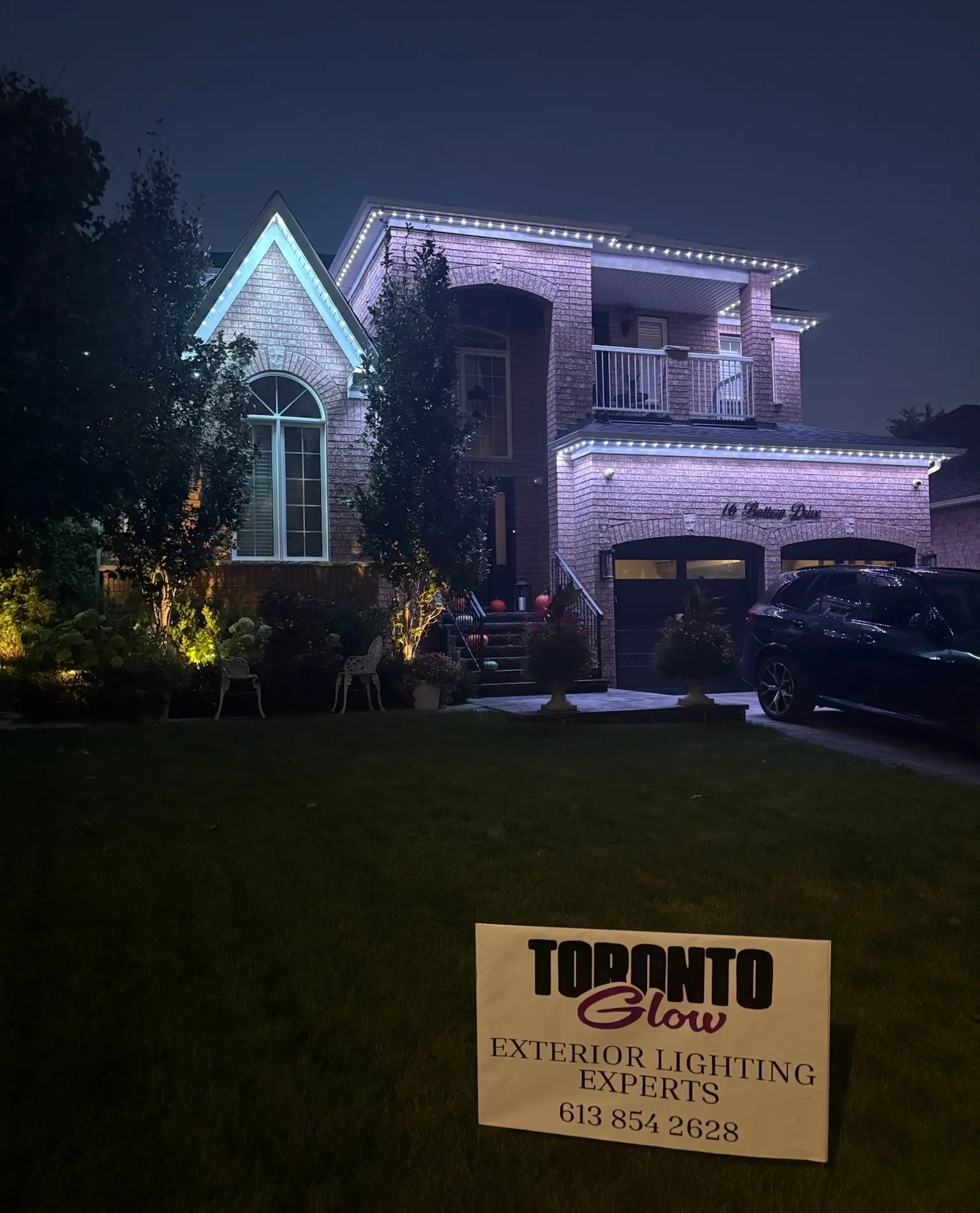 Permanent outdoor lights by Toronto Glow on a GTA home, showcasing the Toronto Glow yard sign.